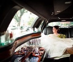 Girl in wedding dress in limo