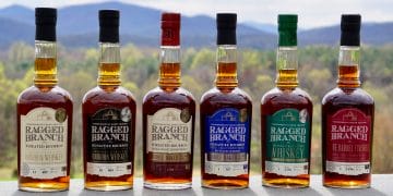 A row of bottles of different types of bourbon and whiskey from Ragged Branch Distillery in Charlottesville, Virginia