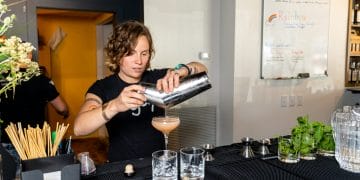 A bar tender pours a drink at Vitae Spirits Distillery in Charlottesville, VA